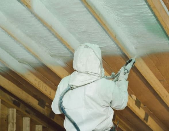 Professional spray foam insulation applied to a roof assembly